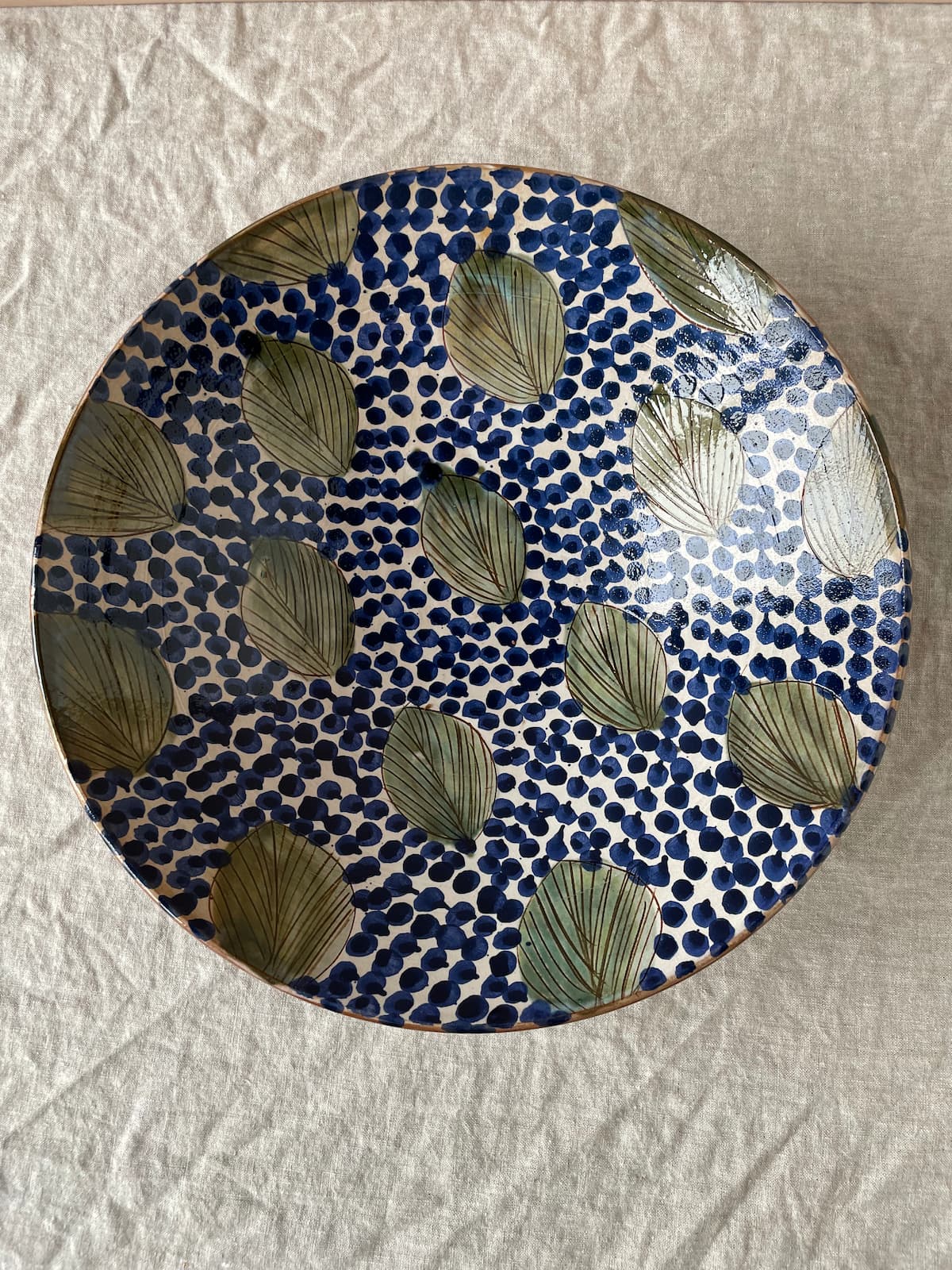 large serving bowl green leaves