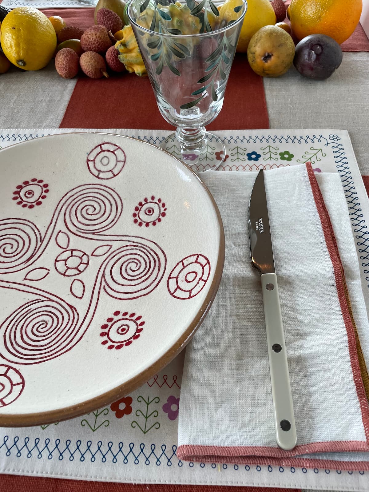 red swirl dinner plate