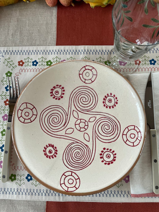 red swirl dinner plate
